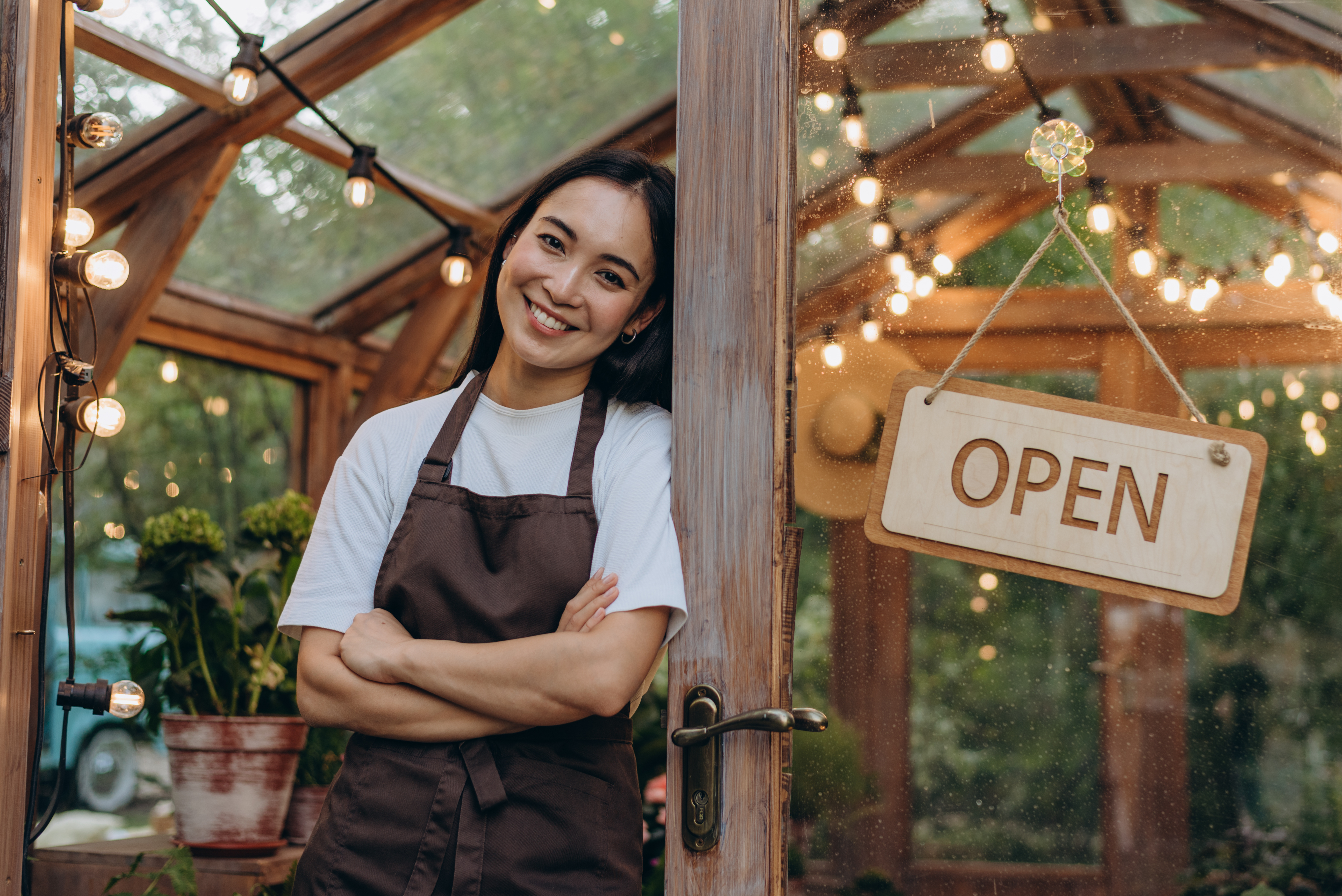 An independent maker at the door of her shop